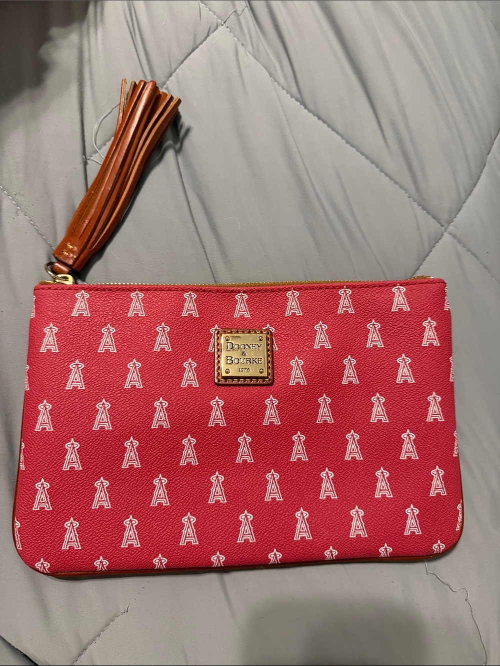 Dooney & Bourke Red Logo Pattern Wristlet with Tan Tassel